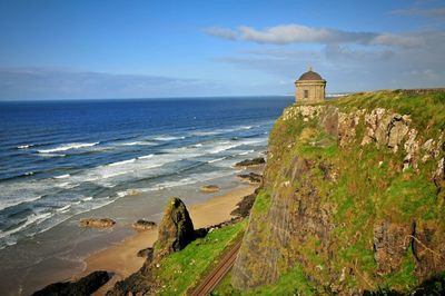 Mussenden temple on cliff by sea