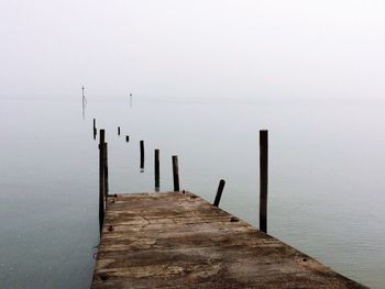 Pier against sea during foggy weather