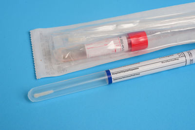 High angle view of plastic on table against blue background