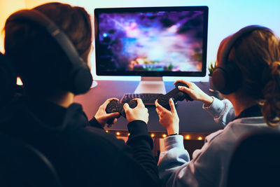 Teenagers playing video game. competition and fun. playing tournament. playing championship