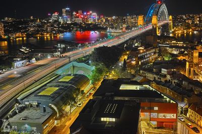 High angle view of illuminated buildings in city at night