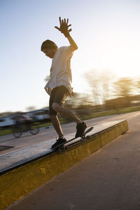 Portrait of skateboarder sliding