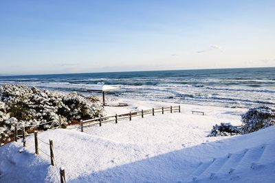 Scenic view of sea against sky during winter