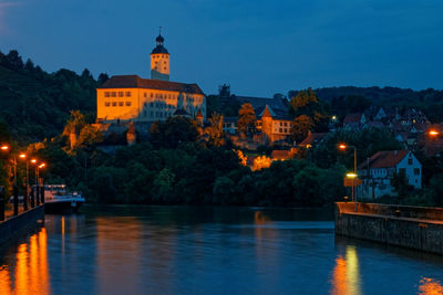 Illuminated buildings at waterfront