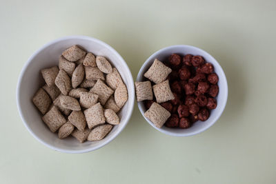 High angle view of breakfast on table against white background