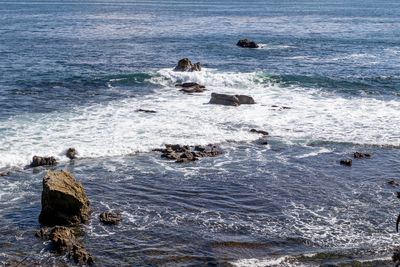 High angle view of rocks in sea