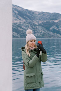 Rear view of woman using mobile phone