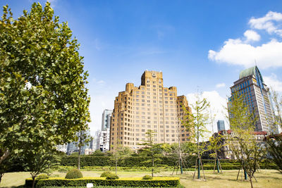 Buildings in city against sky