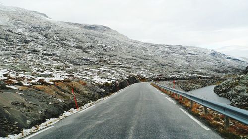 Road on mountain against sky