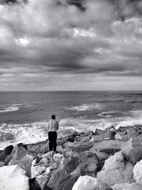 Scenic view of sea against cloudy sky