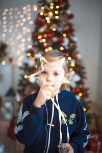 Portrait of boy with christmas tree