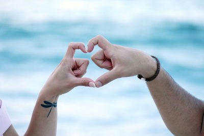 Close-up of hands holding water