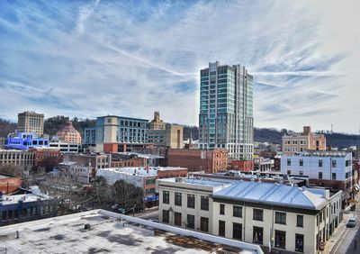 High angle view of buildings in city against sky