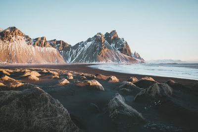 Scenic view of sea against clear sky during winter