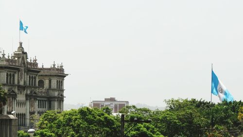 Low angle view of built structure against clear blue sky