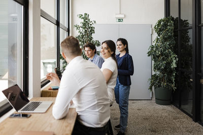 Businessman with colleagues working together in modern office