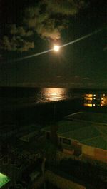 Scenic view of sea against sky at night