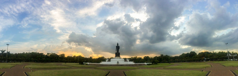 Panoramic view of statue against sky