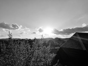 Panoramic shot of agricultural field against sky