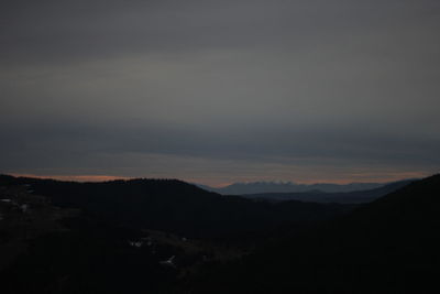 Scenic view of silhouette mountain against sky during sunset