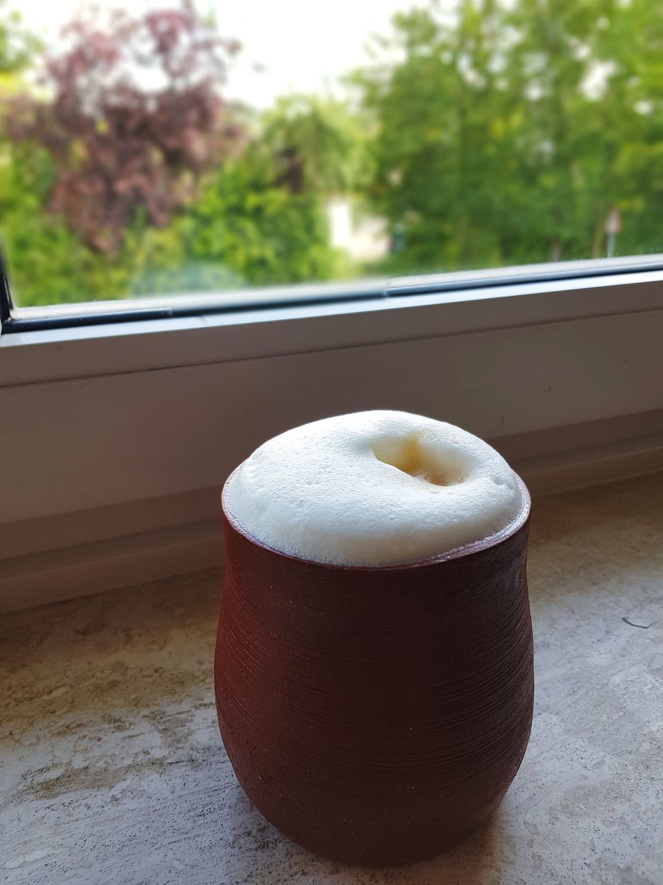 HIGH ANGLE VIEW OF BREAKFAST ON TABLE AGAINST WINDOW