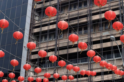 Low angle view of red lanterns hanging on building