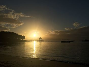 Scenic view of sea at sunset