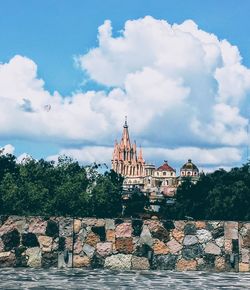 View of temple against cloudy sky