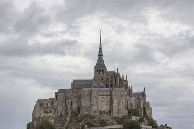 Low angle view of historical church against sky