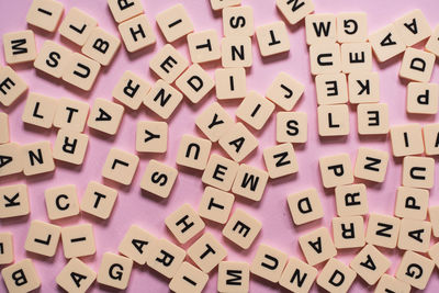 Alphabet letters on pink background