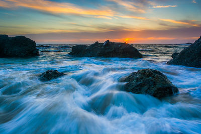 Scenic view of sea against sky during sunset