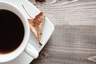 High angle view of coffee cup with tea