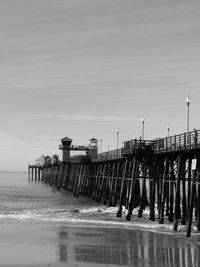 Pier over sea against sky