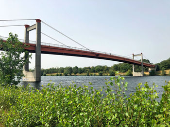 Bridge over river against sky