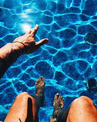 Low section of person in swimming pool