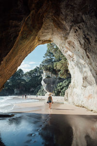 Rear view of man on rock formation