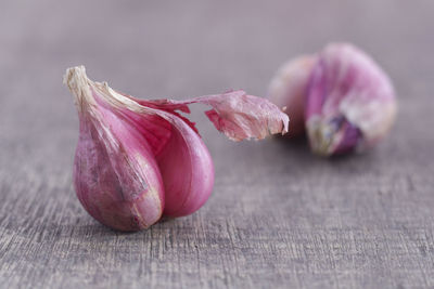 Close-up of pink garlic on table