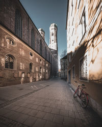 Street amidst buildings against sky in city