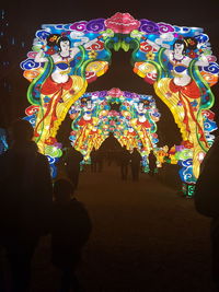 Silhouette of illuminated lanterns at night