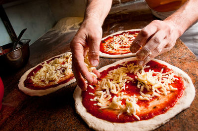 Midsection of man preparing food