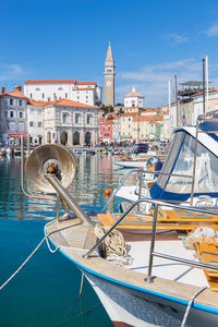 Boats moored at harbor