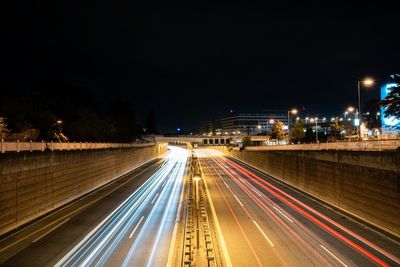 High angle view of light trails on the highway a100 at night