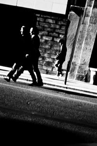 People walking on street in city