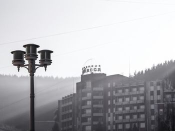 Low angle view of street light against sky