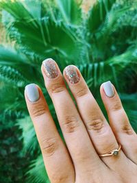 Close-up of woman hand showing nail art