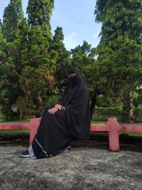 Rear view of man sitting in park