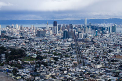 High angle view of modern buildings in city against sky