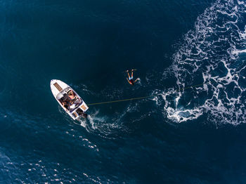 High angle view of people on boat in sea