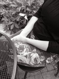 High angle view of woman sitting at park