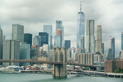 View of skyscrapers against cloudy sky